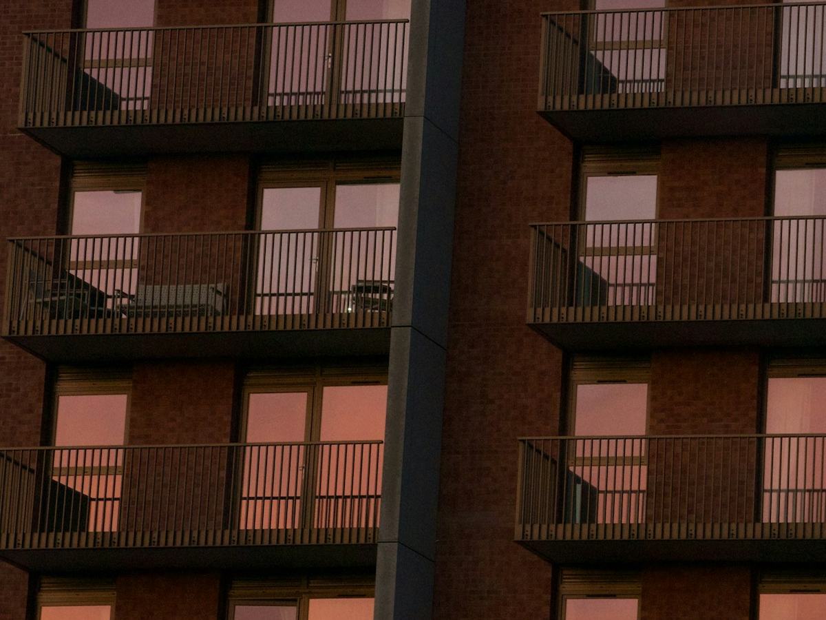 Modern building with balconies at sunset
